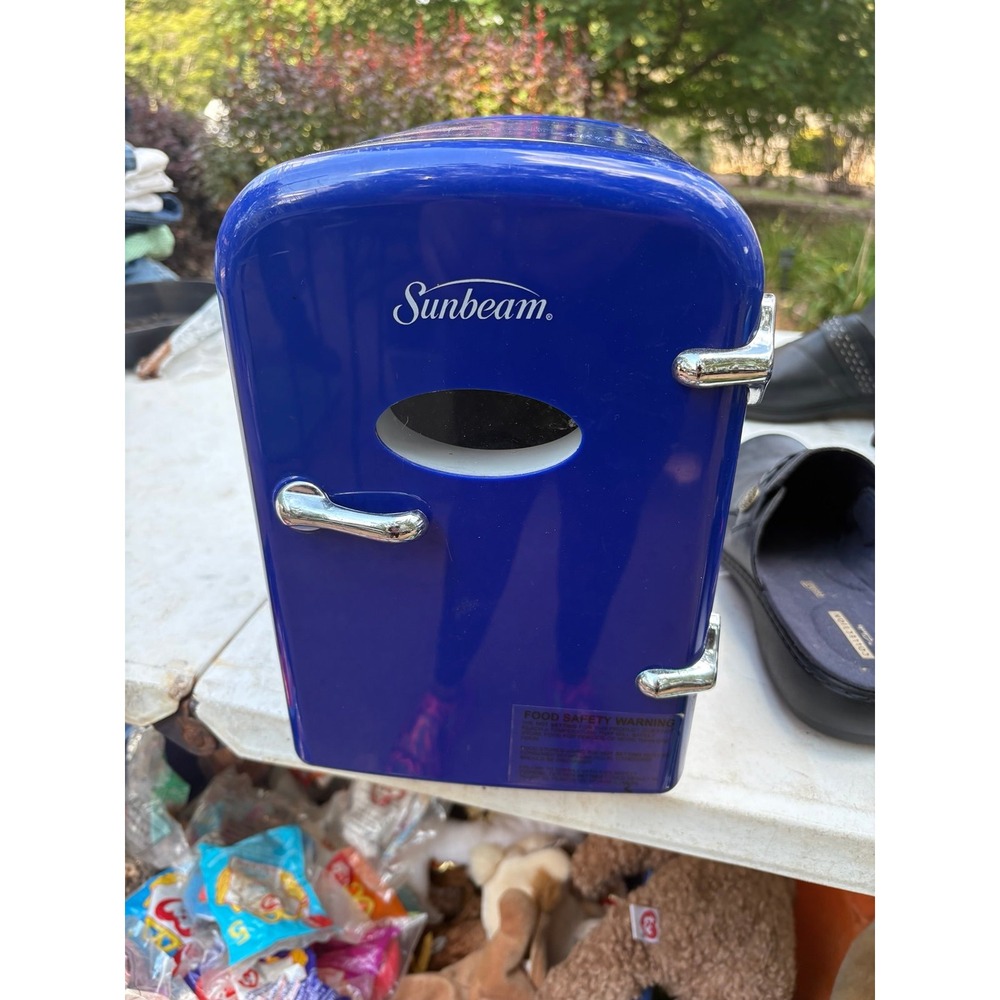 Sunbeam mini-fridge, a compact and portable cooling and warming unit.